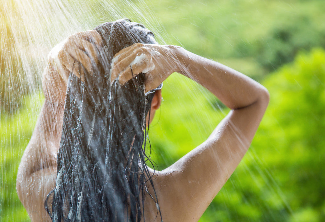 Using natural hair products & coconut oil hair benefits - outdoor shower & shampoo